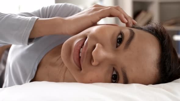 Beautiful African Girl Resting in Bed