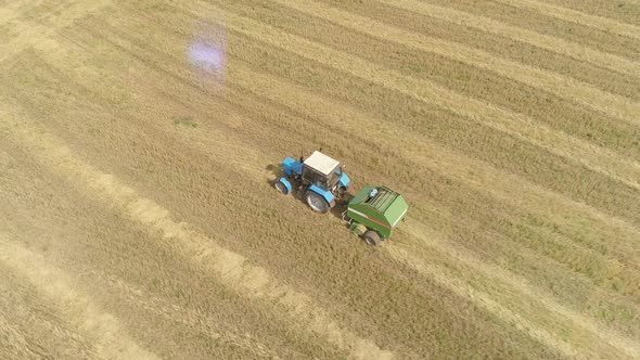 Aerial Footage From Dron of Farm Tractor on Field