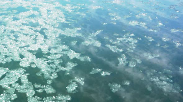 drift ice flowing down the snowy river