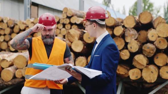 Architect Gesturing Vigorously And Scolds Worker Builder