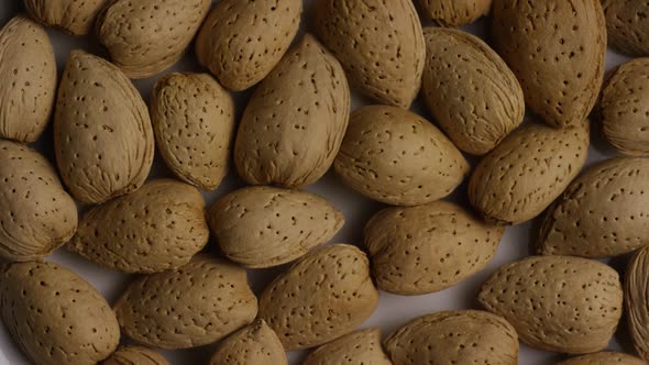 Cinematic, rotating shot of almonds on a white surface - ALMONDS 049