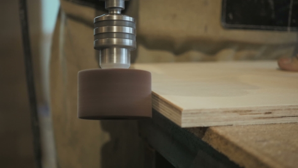 Worker Using Staple Gun To Fix Wood Parts