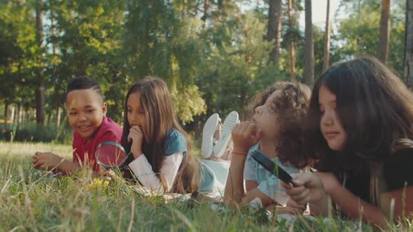 School Kids Discussing Nature Objects During Biology Classes Outdoors