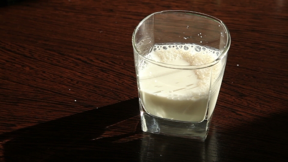The Glass Of Milk On Old Wooden Table 