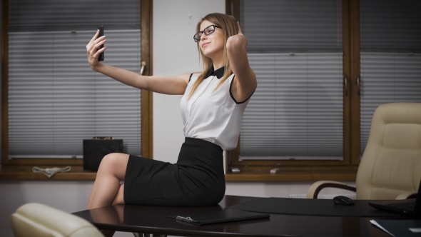 Happy Businesswoman Making Selfie Photo In Office