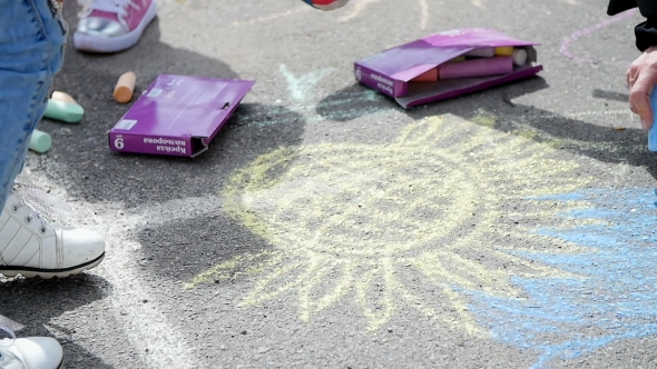 Children Draw Chalk On Asphalt