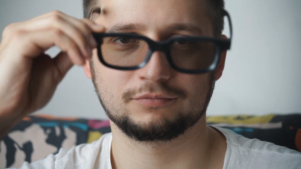 Portrait Of a Man Dressing 3D Glasses And Smiling