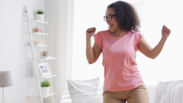 Happy African American Young Woman Dancing At Home 43