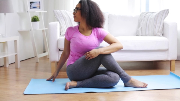 Happy African Woman Exercising On Mat At Home 65