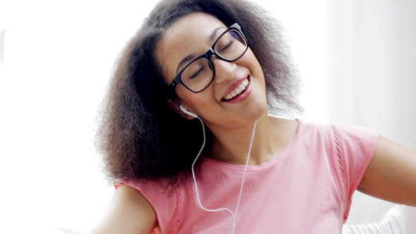 African Woman With Earphones Listening To Music 113