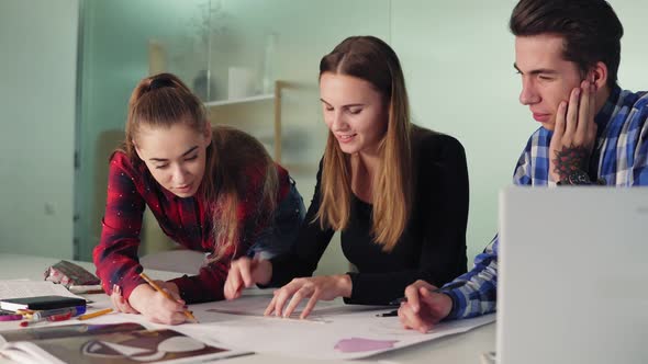 Group of Interior Designers Preparing the Project Together in the Office