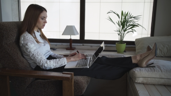 Attractive Woman Buys Online With Credit Card And Computer.