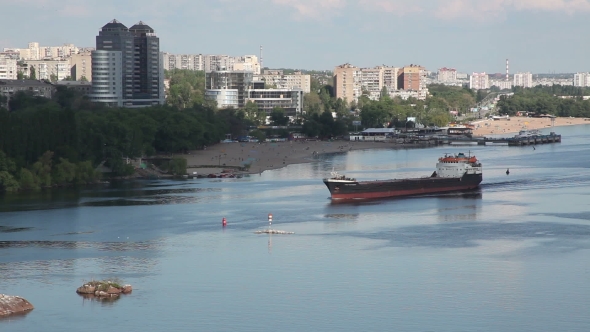 Ukraine. The City Of Zaporozhye. Cargo Ship Sails On The River Dnieper.
