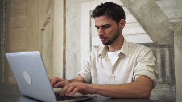 Portrait Young Professional Man Working On Computer.