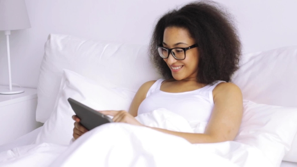 African Woman With Tablet Pc In Bed At Home 80