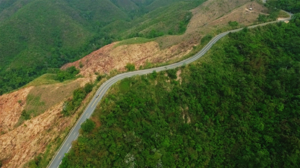 Aerial Pick-Up Truck Driving Up the Mountain Road 02