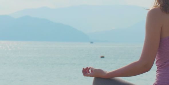 Sea and Hand of Meditating Woman