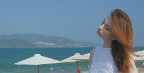 Portrait of Beautiful Woman on the Seashore