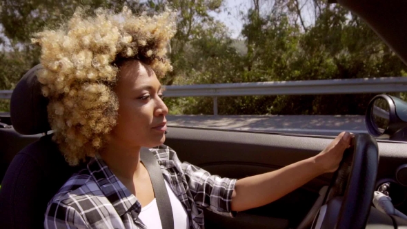 Attractive Young African American Woman Driving