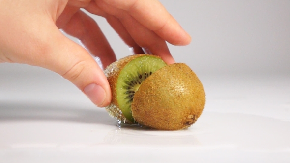 Take Kiwi Fruit On White Surface