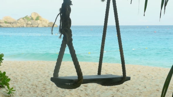 A Rope Swings On The Beach