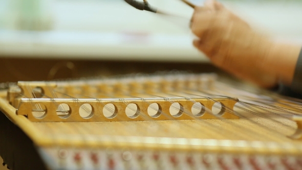 Woman Playing the Dulcimer in the College of Music