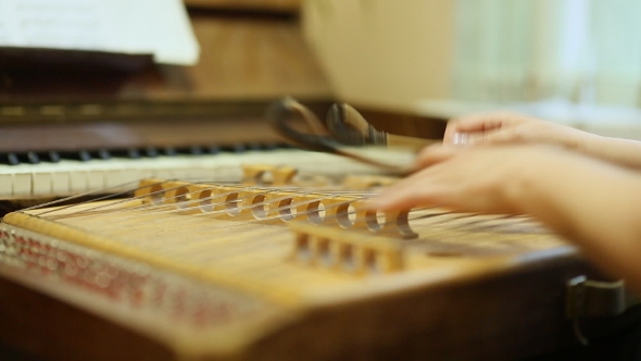 Woman Playing the Dulcimer in the College of Music