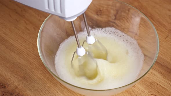 Woman Beats Egg Whites with a Mixer