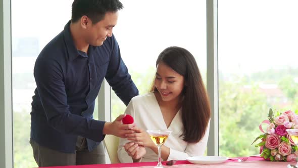 Happy Romantic Couple Eating Lunch at Restaurant