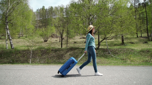 Girl Goes On The Road With a Suitcase