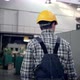 Engineer in Hard Hat is Moving Through a Heavy Industry Factory with a Tablet Computer - VideoHive Item for Sale