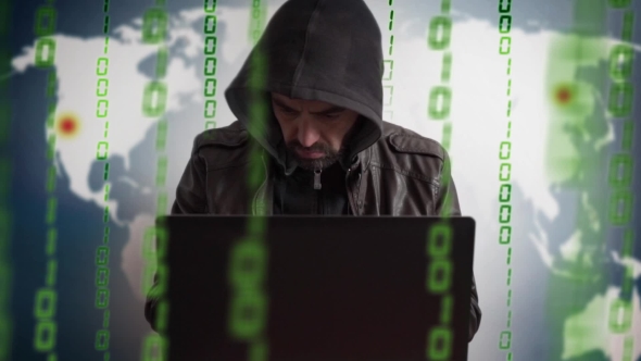 Bearded Hacker In a Hood With Laptop. Online World Network Danger.