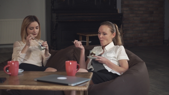 Two  Women Office Workers Eating Dessert 