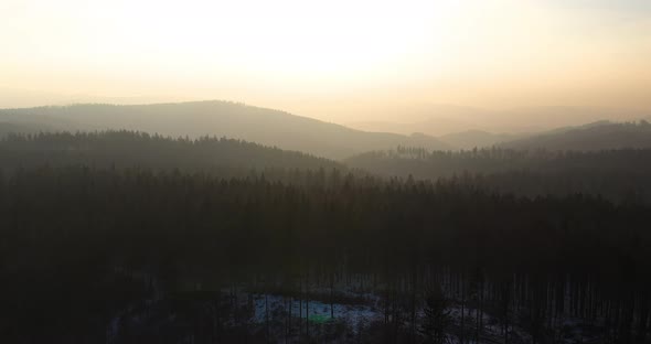 Aerial View of Woods and Mountains in Winter