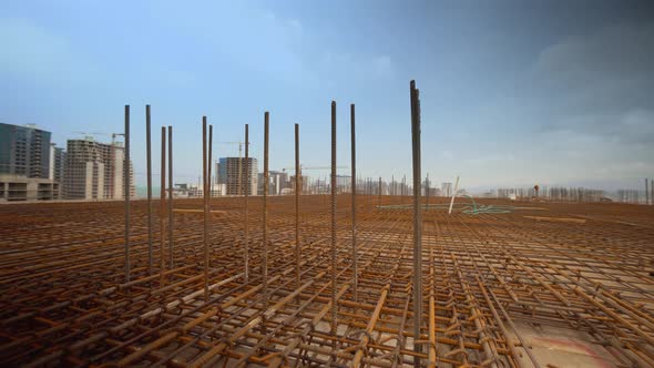 Iron reinforcement is basis for pouring foundation of house with concrete slab.