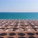 Flight Over the Beach with Umbrellas Towards the Pool in a Luxury Hotel - VideoHive Item for Sale