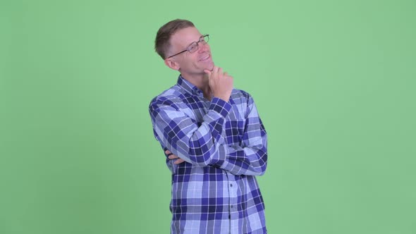 Portrait of Happy Hipster Man Thinking and Looking Up