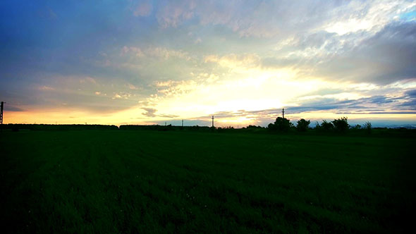 Sunset Over A Field Of Wheat
