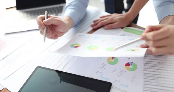 Business People Studying Documents with Graphs and Diagrams in Office  Movie Slow Motion