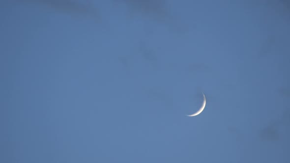 Young Moon in the Sky Through the Transparent