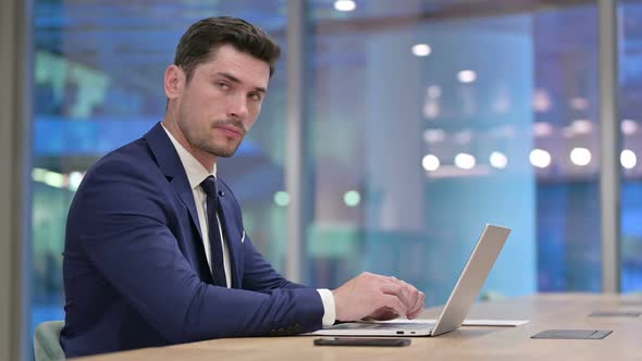 No Rejecting Businessman Looking at Camera in Office