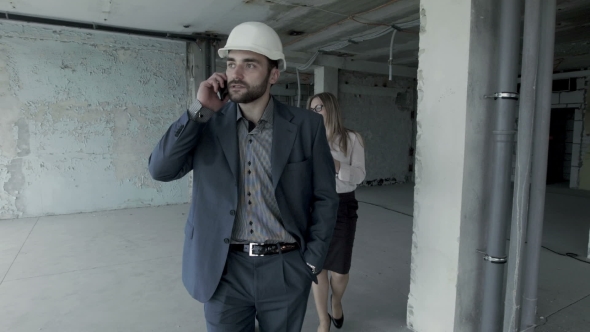 The Owner Of The Building Concerned About Stopping Of Repair Works And Calling To The Contractor