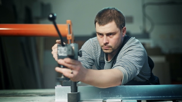 Carpenter Working In Studio