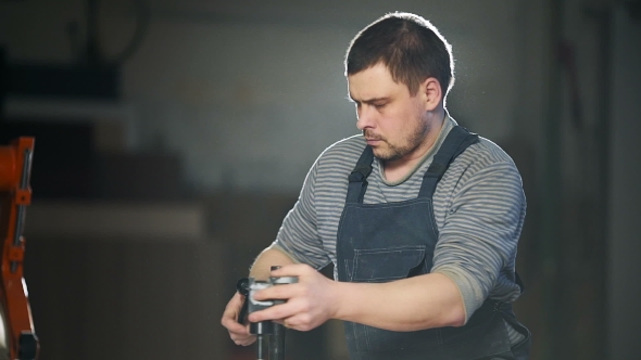 Carpenter Working In Studio