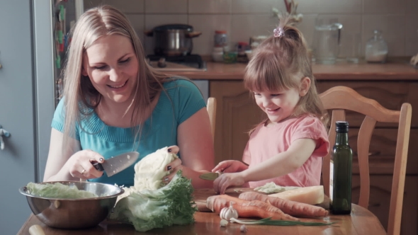 Daughter And Mother Chop Cabbage