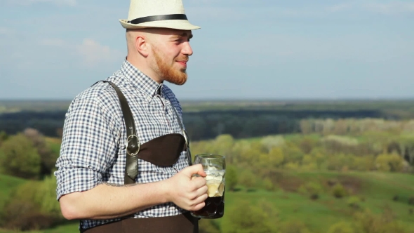 A Man In a Spring Day Enjoying a Delicious Dark Beer.
