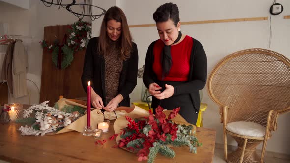 Women making Christmas bouquets together