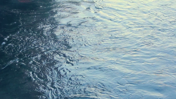 Water Surface Ripples. Water Background. Sunlight In Water Waves. Blue Water