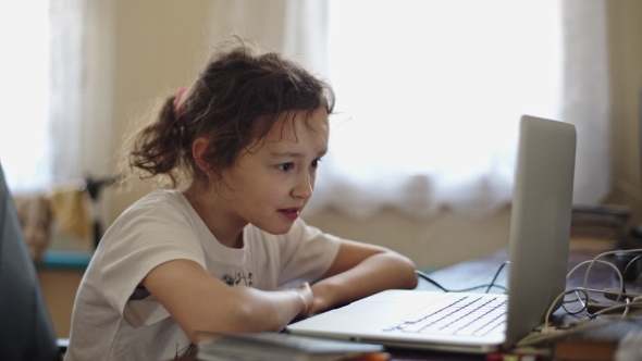 Girl Watching Something On The Laptop