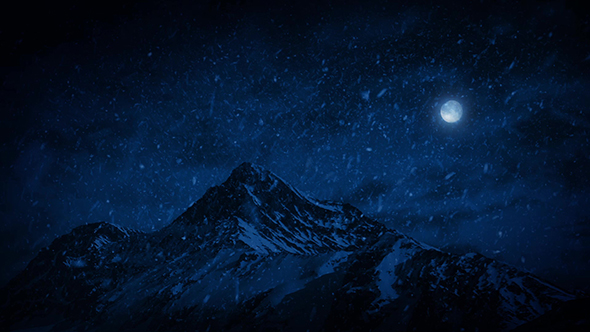 Snow Falling On Mountains At Night